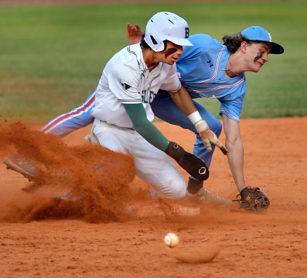 Beaufort’s Dominic Camacho makes to second base as the ball skips away during the bottom of fourth inning against the Hanahan Hawks on Thursday, May 11, at Beaufort High School. The Eagles gave up four runs in the fifth and two runs in the sixth allow the Hawks to tie the game at 7. Hanahan finally won the game, 10-9, after 12 innings. Bob Sofaly/The Island News