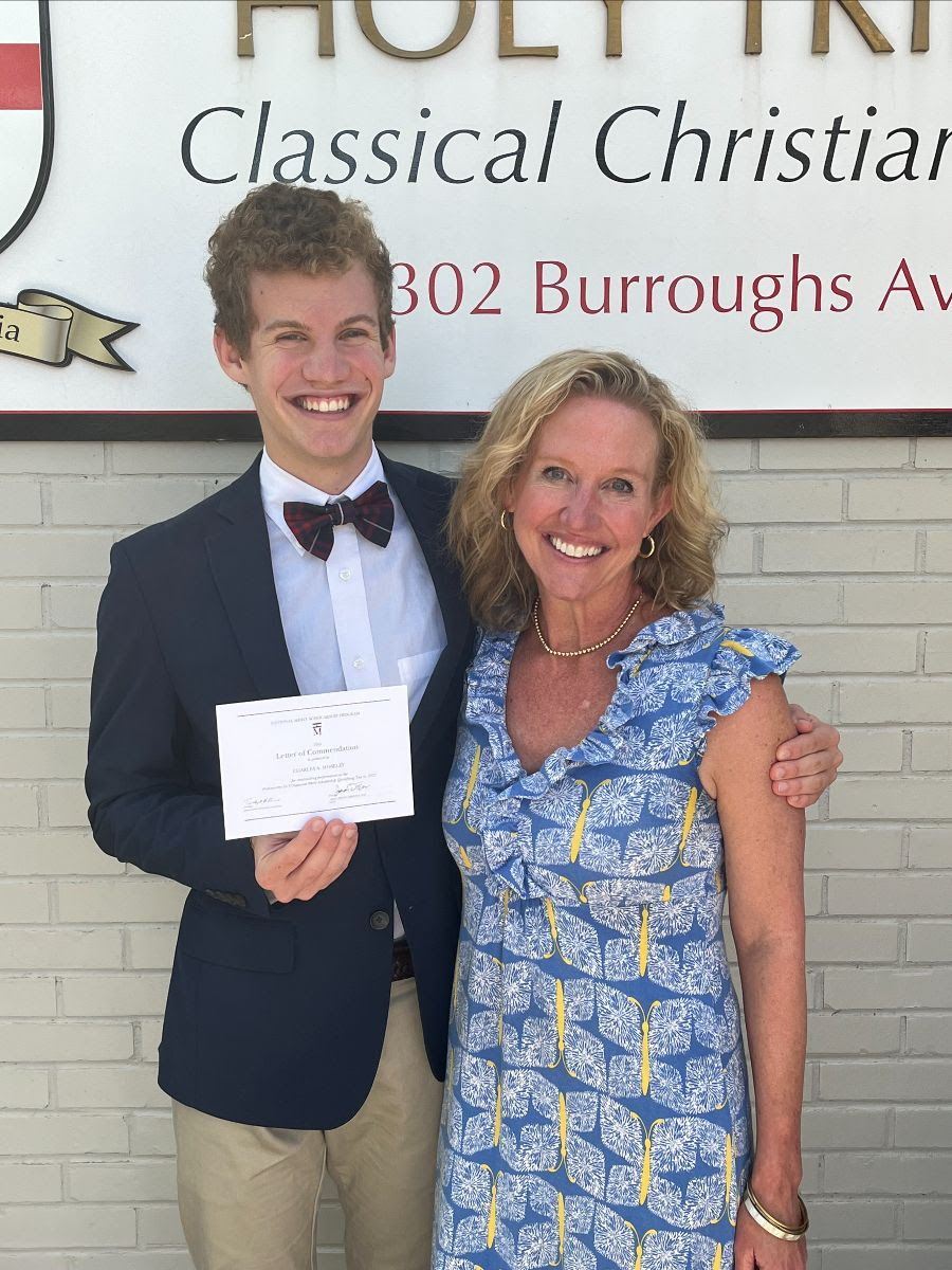 Holy Trinity Classical Christian School senior Charlie Moseley – pictured with his mother Amy Moseley, Lower School Principal – has been named a Commended Student in the 2024 National Merit Scholarship Program. Photo courtesy of HTCCS