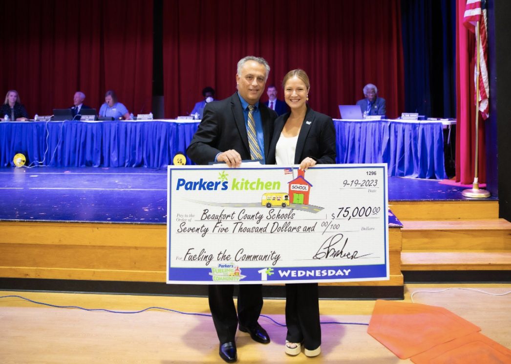Parker’s Kitchen Community Outreach Manager Olivia Parker, right, recently presented a $75,000 Parker’s Fueling the Community donation to the Beaufort County Schools District (BCSD). BCSD Superintendent Frank Rodriguez, left, accepted the donation at a school board district meeting on September 19. Submitted photo