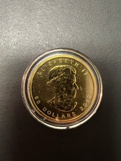 The front of the gold coin that was donated to the kettle outside of the Sam’s Club in Bluffton. Photos courtesy by Salvation Army Capt. Wanda Long