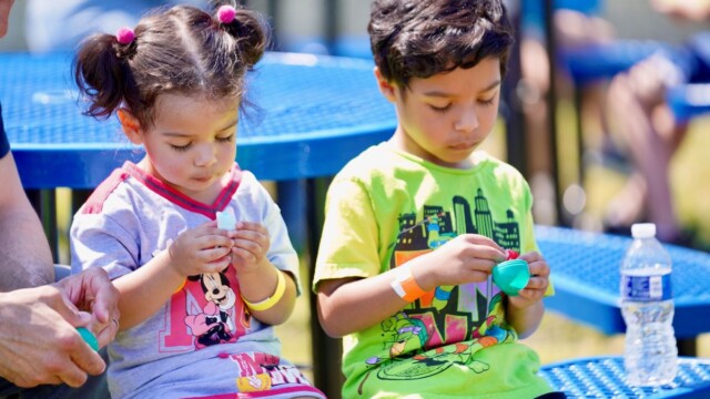Beaufort’s Cecelia Godbolte, 2, and Theo, 4, examine the contents of eggs after collecting them at the Beaufort Academy Egg Drop on Sunday, March 22, 2026. Amber Hewitt/The Island News