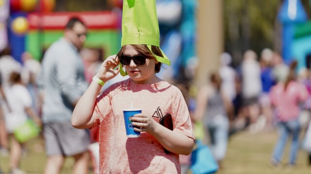 Since his bag was empty, 12-year-old Andrew White of Bluffton utilizes it as a hat until it’s time for his age group to collect eggs at the Beaufort Academy Egg Drop on Sunday, March 22, 2026. Amber Hewitt/The Island News